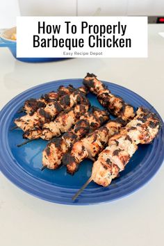 chicken skewers on a blue plate with the title how to properly barbecue chicken