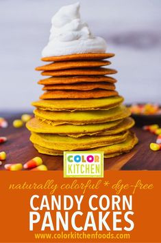 a stack of candy corn pancakes with whipped cream on top