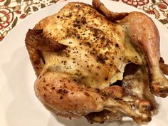 a close up of a chicken on a plate