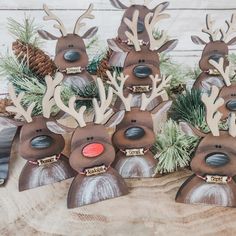 wooden reindeer head ornaments with pine cones and needles