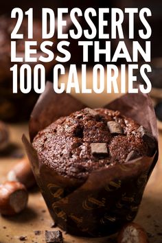 a chocolate muffin sitting on top of a wooden table