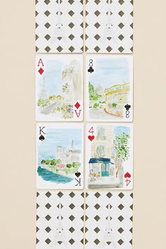 four playing cards with different designs on them