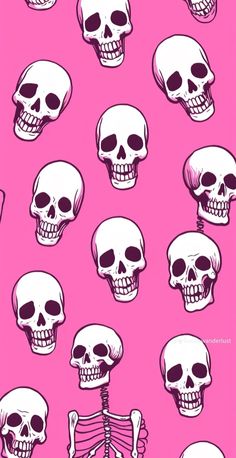 a bunch of skulls on a pink background