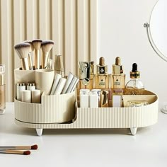 A makeup organizer is the simple solution to your problem and is ideal for streamlining your beauty routine and decluttering your home in one easy step. Not only is this cosmetic organizer practical, but it comes in gorgeous design and size to suit a range of different makeup spaces and needs. This adorable set comes with a larger compartment for storing full-sized bottles and a rotating brush holder to keep your brushes in place. Each compartment can hold a different category. The circular rota Makeup Organizer Countertop, Make Up Storage, Makeup Display, Perfume Organization, Makeup Storage Box, Beauty Organization, Makeup Holder, Úložný Box, Cosmetic Display