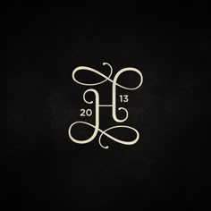 the monogrammed letter h is displayed on a black background