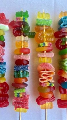 there are many colorful candy lollipops on the stick