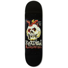 the skateboard is black and has a skull on it's back end,