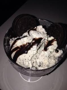 a bowl filled with ice cream and oreo cookies