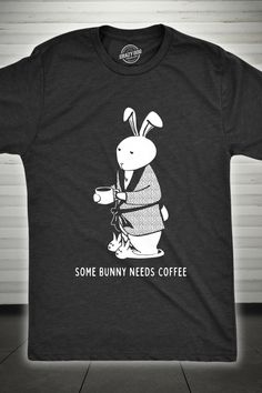 If you're not your best bunny before that first cup of coffee, we've got you covered with our 'Some Bunny Needs Coffee' men's t-shirt. This shirt is a must-have for coffee aficionados with a sense of humor. Its slim fit and comfortable fabric make it perfect for those laid-back Easter mornings. With a hilarious pun that pairs your love for coffee with Easter fun, this novelty tee is just the right blend of style and wit. Get yours today and brew up some smiles this Easter! Muscle Tee Diy, Bunny Needs, Coffee T Shirt, Y2k Graphic Tees, Fitness Shirts, Funny Fitness, Tshirt Printing