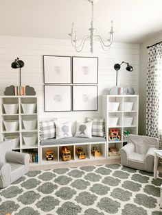 a child's playroom with toys, bookshelves and pictures on the wall