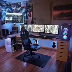 a room with two computer monitors and a chair in front of the desk is lit up