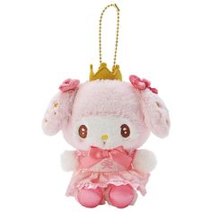 a pink stuffed animal with a gold crown on it's head