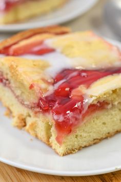 a slice of strawberry cheesecake on a white plate