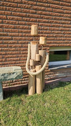 a wooden sculpture sitting next to a bench