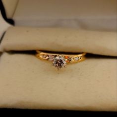 an engagement ring is sitting in a box