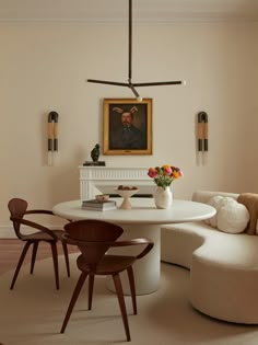 a white table and chairs in a room