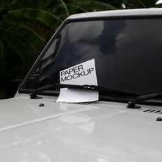 a sticker on the hood of a car that says paper mockup written on it