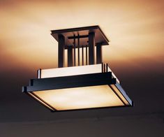 a square light fixture hanging from the ceiling