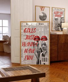 there are two posters on the wall in this living room, one is advertising girls just want to have fun