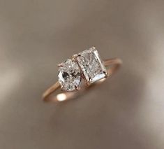 an engagement ring with two princess cut diamonds