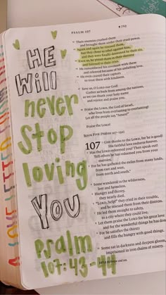 an open bible with the words he who never stop loving you written in green ink