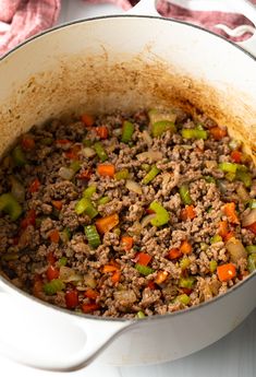 a pot filled with ground beef and vegetables