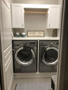 a washer and dryer in a laundry room with the door ajar open