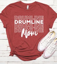 a t - shirt with the words drumline, drumming and more on it