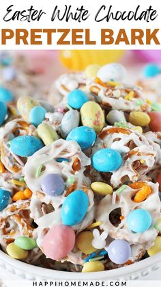 easter white chocolate pretzel bark recipe in a bowl with the title above it