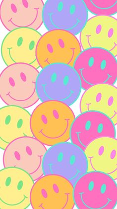 many different colored smiley faces on a white background