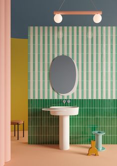 a bathroom with a sink, mirror and stool on the floor in front of a tiled wall