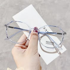 Introducing the Vera Round Glasses - where classic elegance meets modern style. Crafted from premium TR material, these glasses are lightweight yet durable, making them perfect for daily wear. The narrow fit and versatile design complement Square, Heart, Oval, and Oblong face shapes, ensuring a flattering look for everyone. Available in four stunning colors - Champagne, Grey, Black Gold, and Blue - the Vera Round Glasses offer a chic option for every personality. Whether you're dressing up for a special occasion or adding a touch of sophistication to your everyday ensemble, these glasses are the perfect accessory. Measurements: 51-16-146 Features: *Fits Square, Heart, Oval, and Oblong face shapes *Comfortable narrow fit *Made from high-quality TR material *Available in Champagne, Grey, Bla Cute Glasses Frames, Glasses Frames Trendy, Classy Glasses, Fancy Glasses, Clear Glasses Frames, Glasses Trends, Round Eyewear, Trendy Glasses, Blue Glasses