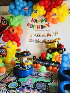 a birthday party with balloons and toys