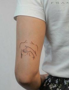 a person with a small tattoo on their arm