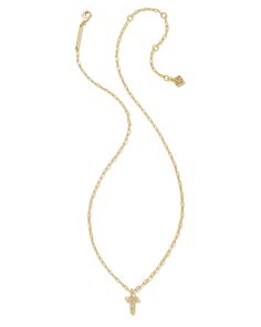 Personalize your everyday look with the Crystal Letter T Gold Short Pendant Necklace in White Crystal. Whether you’re rocking your initial or a loved one’s, this sentimental layer is one you’ll keep coming back to again and again. Metal 14k Gold Over Brass Material White CZ Closure Lobster clasp Size 16" chain w/ 3" extender, 0.62"L X 0.35"W pendantDue to the one-of-a-kind nature of the medium, exact colors and patterns may vary slightly from the image shown. | Kendra Scott Crystal Letter T Gold Short Pendant Necklace, Delicate Gold Necklace, Kendra Scott Necklace, Gold Shorts, Letter Pendant Necklace, Buy Crystals, Again And Again, Letter Pendants, White Crystal