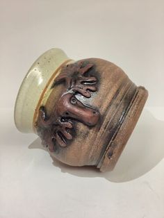 a ceramic object that looks like it has been painted on