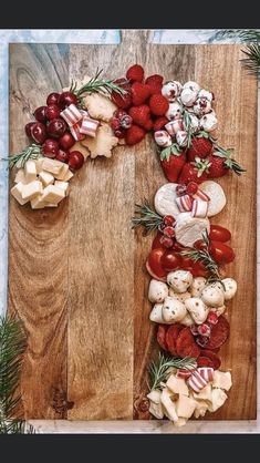 a wooden table topped with lots of different types of food on top of each other