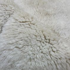 the fur is white and fluffy, but it's hard to tell what color it is