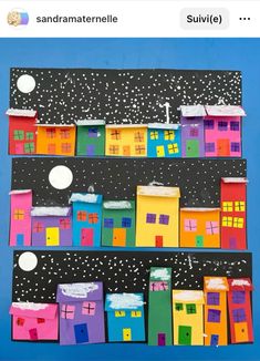 an image of some houses made out of construction paper on a blue background with stars and snow