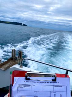 the back end of a boat with a clip board on it