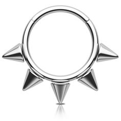 a silver ring with three spikes on the front and one in the middle, against a white background