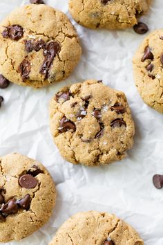 chocolate chip cookies on top of white paper