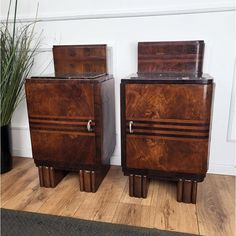 two wooden nightstands sitting next to each other on top of a hard wood floor