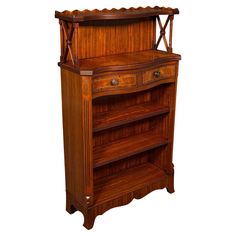 an antique wooden bookcase with two drawers