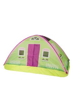 a green and pink tent sitting on top of a white floor