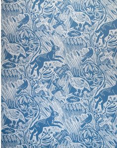 a blue and white wallpaper with animals on it