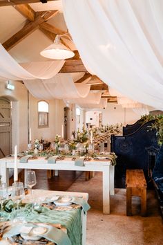 a long table is set with place settings