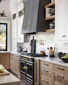 a kitchen with an oven, stove and counter tops in it's center island