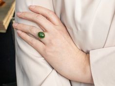 This stunning 1950’s mounting is a rich combination of yellow gold and deep, pine-green JNephrite Jade. The metalwork around the stone is simple and subtle, with a sweet stylized flower framing this lovely stone. This would make a great and different cocktail ring, and the color is truly superb! Metal: 14K Yellow GoldGem: Nephrite JadeGem Measurements: 14.1 x 11.7 mm, OvalRing Size: 6.25Marks: "14K" Stamped on the inside band Pocket Watch Chain, Nephrite Jade, Jade Ring, Watch Chain, Vintage Botanical, Flower Frame, Cocktail Ring, Pearl Pendant, Cocktail Rings