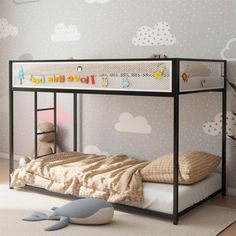 a child's bedroom with a black bunk bed and white clouds on the wall